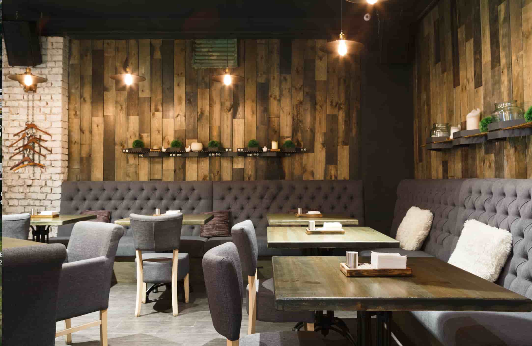 Restaurant booth seating with upholstered banquettes and tables for café and commercial dining interiors