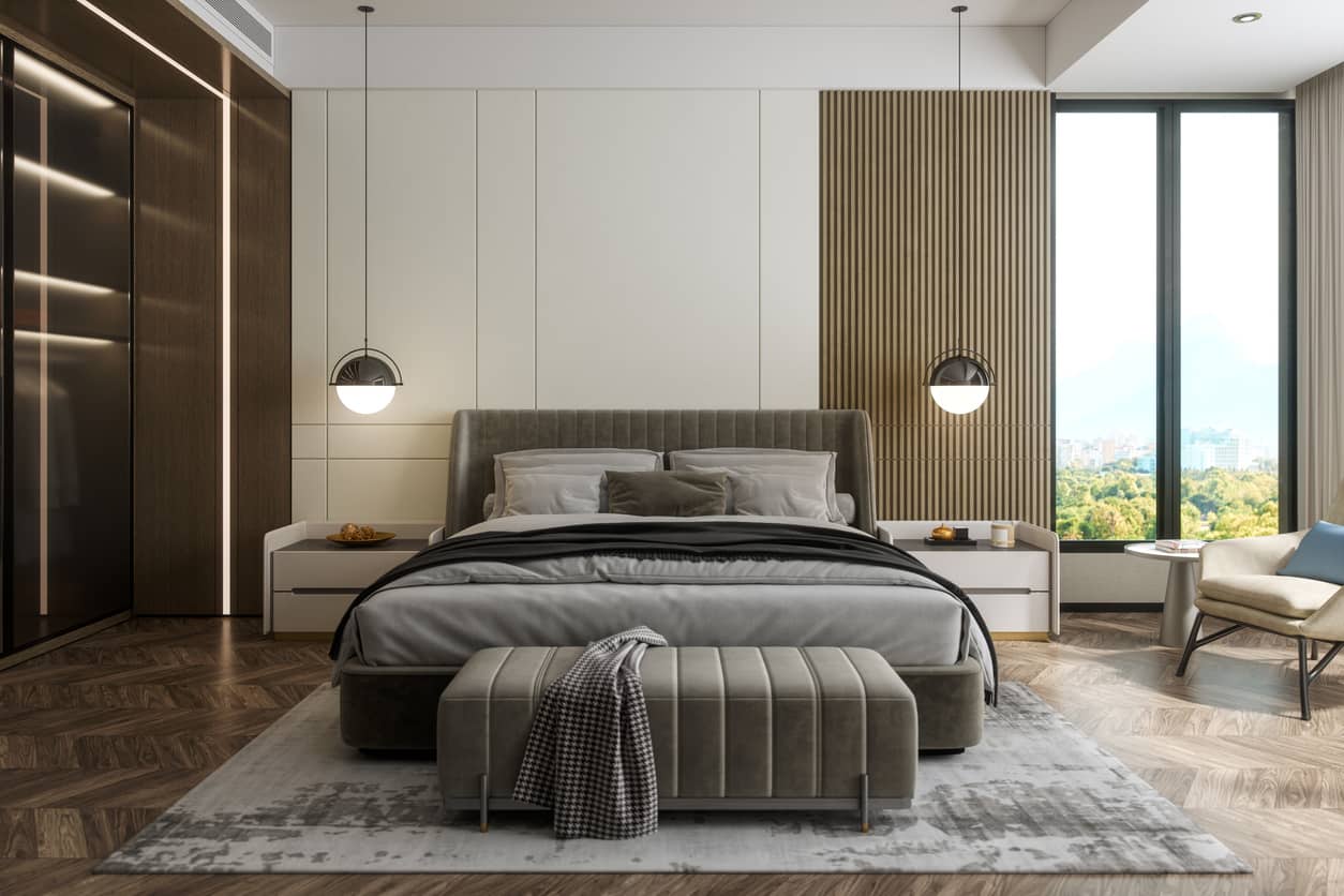 Premium hotel suite bedroom set with wood panel walls and seating area