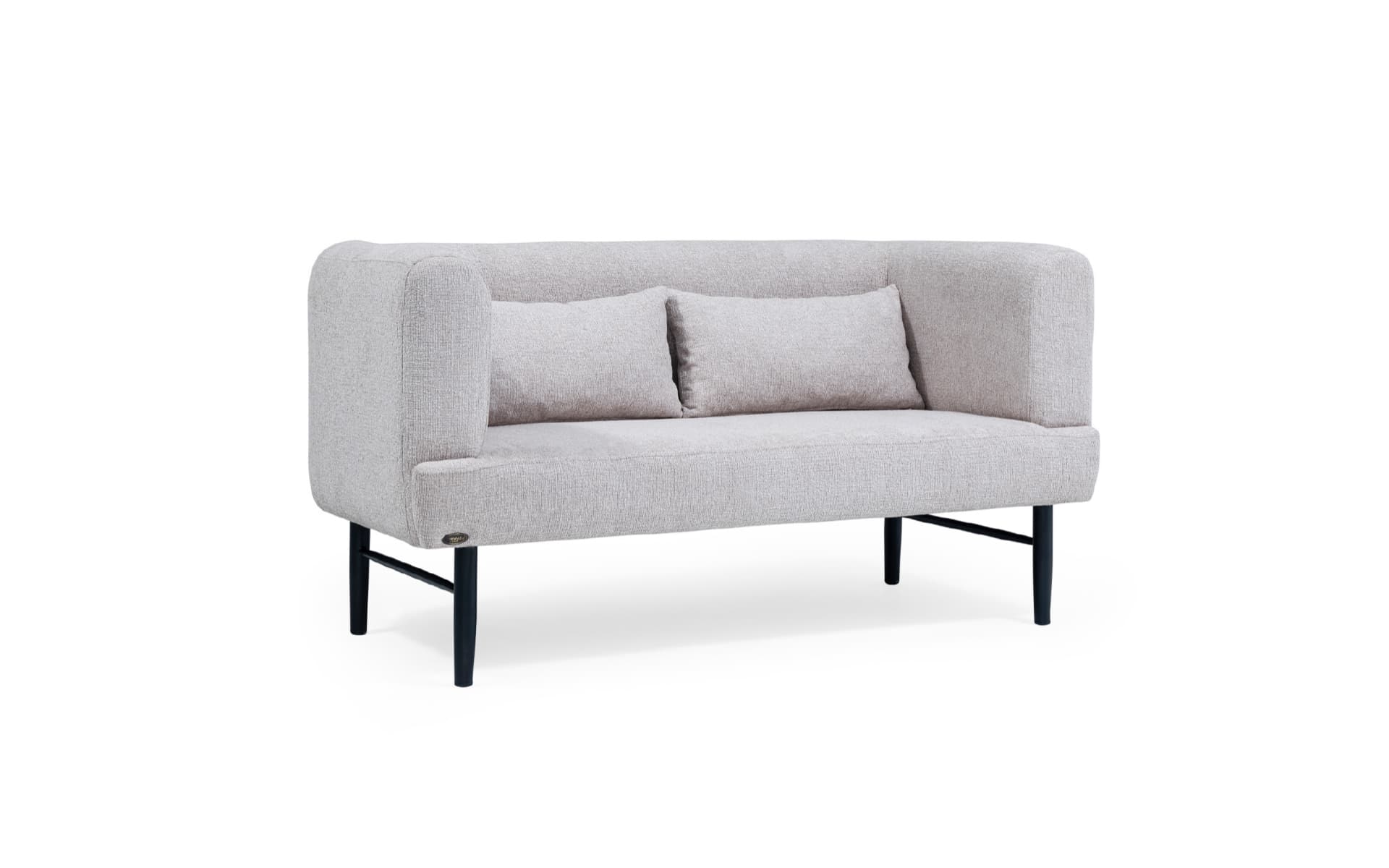 Modern hotel lobby sofa with light fabric upholstery, rounded arms, and slim black metal legs.